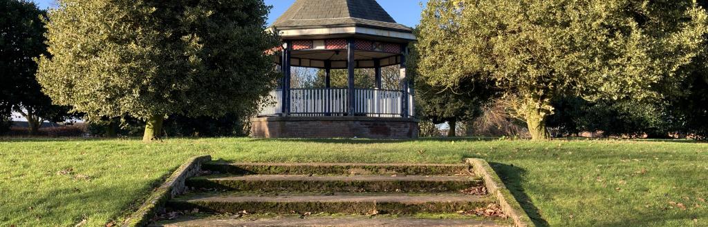 Bandstand surrounded by holly trees