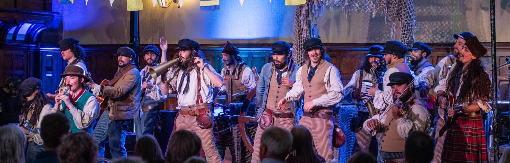 Sea shanty performers on stage at Barrow Town Hall