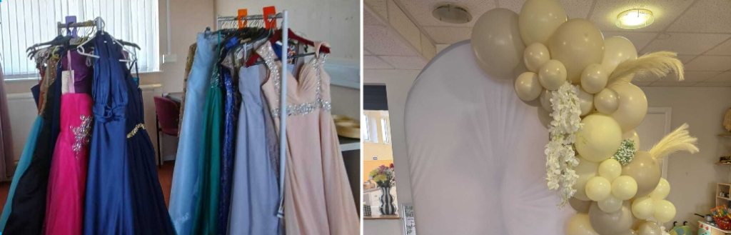 prom dresses on hangers and the balloon arch