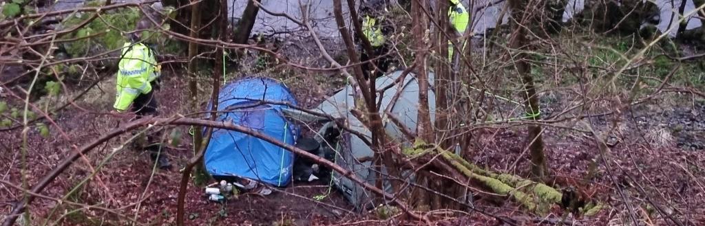 Illegal campsite set up on the shores of Ullswater in a woodland