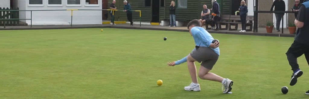 People playing crown green bowls at the King Alfred Bowling Club