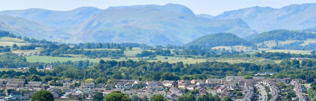 Houses in Penrith with the Lake District hills in the background