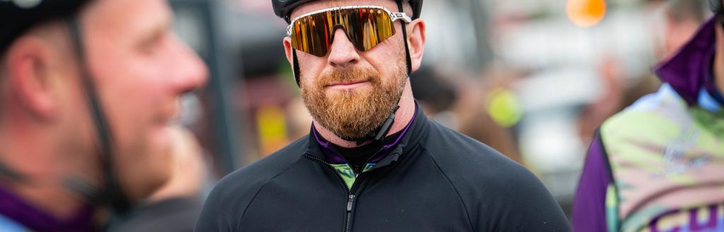 Sir Bradley Wiggins dressed in black cycling gear.