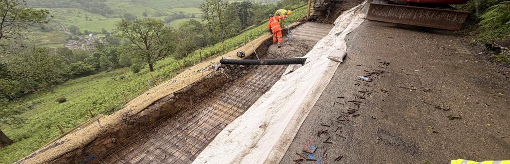 Contractors working on the repairs on the A592 landslip at High Kingate