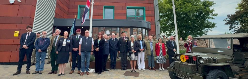 Armed Forces Week flag raising event outside Voreda House