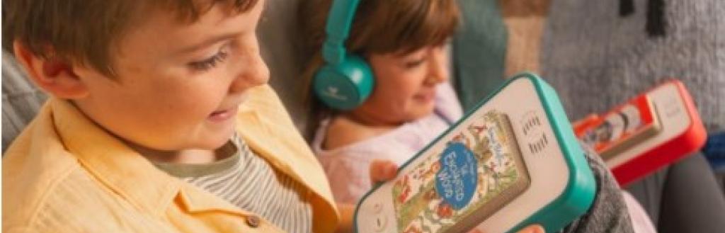 Two children listening to stories on the Voxblock audiobook player