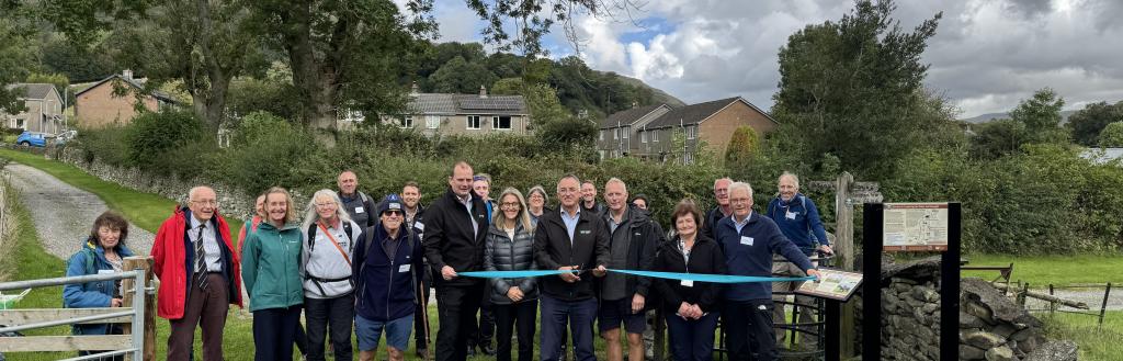 Westmorland and Furness Council leader Councillor Jonathan Brook and Cabinet member for Environmental Services and Transport, cut the ribbon to launch the new Westmorland and Furness Way along with guests