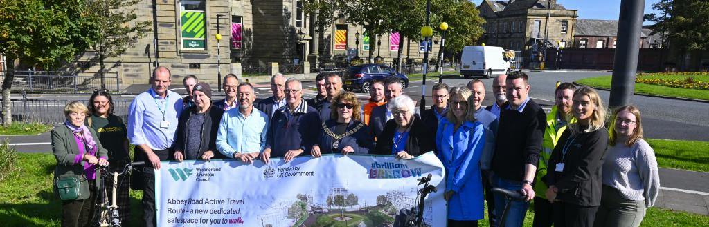 Olympic gold-medal-winner Chris Boardman CBE,  the National Active Travel Commissioner for Active Travel England, pictured with guests at the launch event of the new Abbey Road walking, wheeling and cycling route on Wednesday, including local councillors and representatives from Active Travel England,  Brilliant Barrow and Team Barrow.